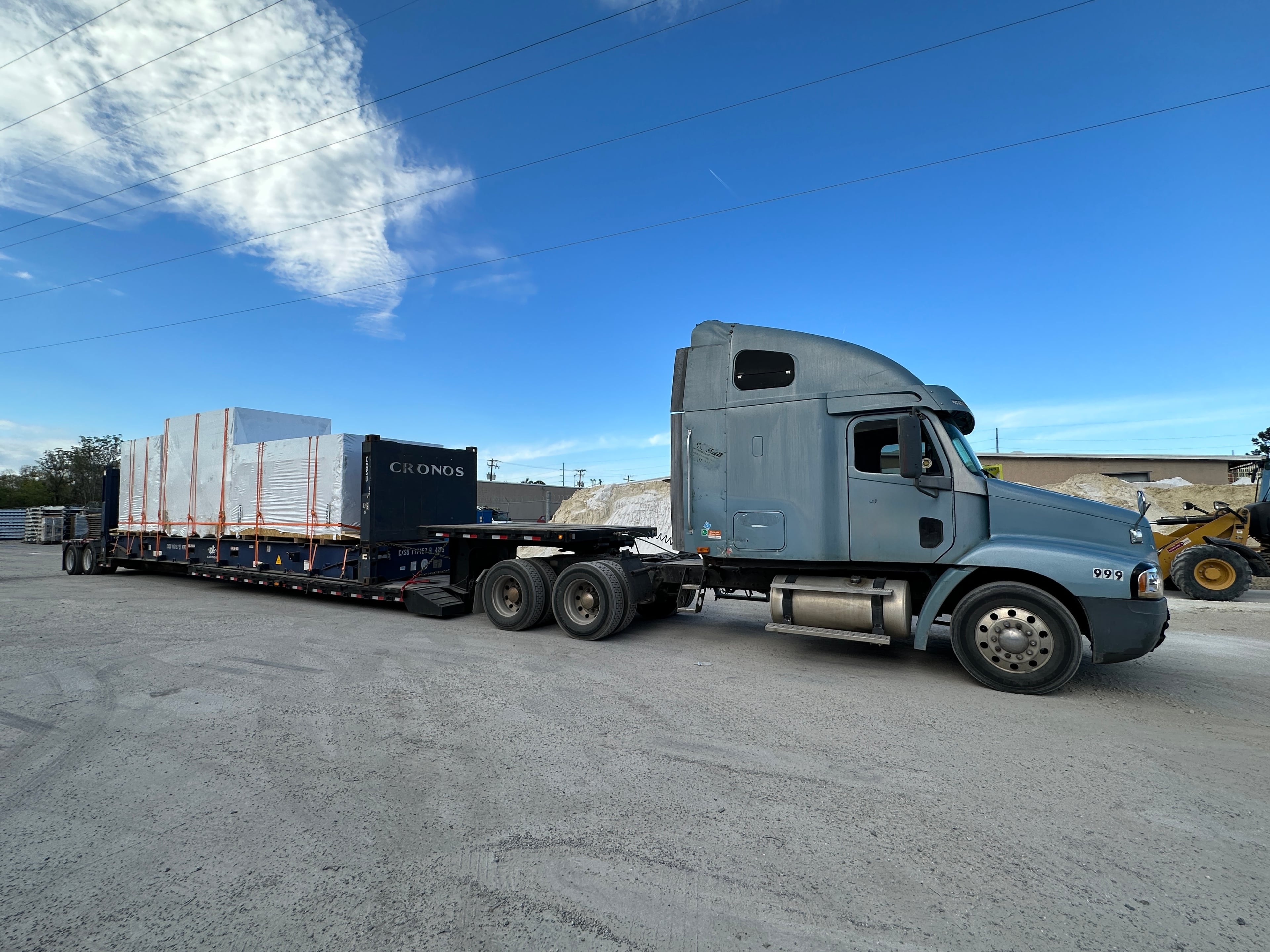 AIM Trucking Equipment Fleet - Specialized trailers including RGN, Step Deck, and Container Chassis